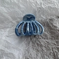 Detail view of a blue marble texture hair claw clip with a fan-shaped hollow design - Small (5.5cm) / Blue Marble