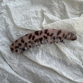 Close-up of tortoise shell banana hair clip in purple and brown leopard pattern - Light Brown Polka Dots