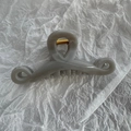 Close-up of a large grey minimalist hair claw clip with a strong gold metal spring detail - Jelly Grey