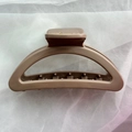 Detail view of khaki matte silicone hair claw clip showing inner spring and teeth - Deep Coffee Semi-circle