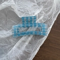 Detail of blue gingham rectangular hair claw clip with translucent crystal texture - Block Shape