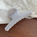 Detail view of large lavender butterfly hair claw clip with spring and non-slip teeth - Light Grey White