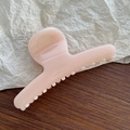 Detail of light pink glossy hair claw clip showing a smooth resin finish and strong teeth grip - Snow Bud Pink