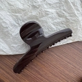 Close-up of large glossy dark brown resin hair claw clip for thick hair styling - Dark Coffee