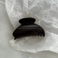 Close-up of polished dark coffee hair claw clip showing glossy resin surface and inner teeth - Solid Dark Coffee