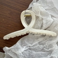 Detailed view of large marble texture hair claw clip with golden high-elastic metal spring - Creamy White Dual-Tone