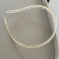 Close-up of transparent resin headband featuring fine anti-slip teeth for secure styling - Champagne Two Tone Flow Hairband