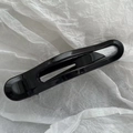 Macro shot of minimalist glossy black leopard claw clip on artistic white paper - 11cm Duckbill Glossy Black