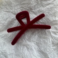 Detail of burgundy flocked velvet hair claw with cross-line design on textured background - Flocking Wine Red