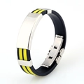 Detail of black and yellow silicone men's bracelet with Greek meander pattern and steel plate - Yellow