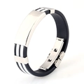 Detailed close-up of men's black silicone sport bracelet with polished stainless steel plate - White