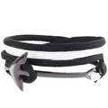Close-up of nautical rope bracelet with a gun-black metal anchor hook on white background - Simple Black & White (05)