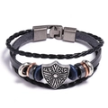 Close-up of vintage leather bracelet showing Celtic shield charm and magnetic clasp - Wolf Eagle Shield Style / Shield Black