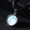 Macro shot of luminous moon pendant with black wax rope and silver alloy frame - Light Blue Planet Style (9*)