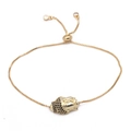 Pulsera bolo dorada con dije de cabeza de Buda y piedras de circonita negra micro-pavé - Estilo Cabeza de Buda / Dorado