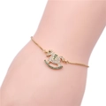 Pulsera de caballo balancín dorada con circonitas cúbicas blancas y verdes brillantes - Oro Circonita Verde