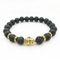 Zen-style black lava stone beaded bracelet with gold Buddha head and spacer beads - Gold Buddha Head