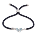 Verstellbares blaues Webarmband mit silbernem Schmetterlingsanhänger und blauen Zirkonia - Silber