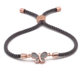 Verstellbares Schmetterling-Armband mit Türkissteinen und grauem geflochtenem Band - Roségold