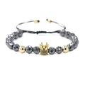 Detail of beaded bracelet with black hematite facets and gold zircon crown charm - Gold Crown