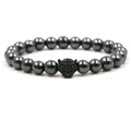 Handmade hematite beaded bracelet featuring a black copper leopard head with green zircon eyes - Black