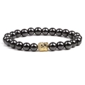 Magnetic hematite beaded bracelet featuring a golden Buddha head bead on white background - Gold