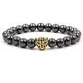 Handmade beaded bracelet with polished black hematite stones and golden leopard head charm - Gold
