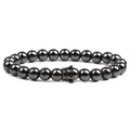 Men's magnetic hematite beaded bracelet featuring a micro-pave crown charm on white background - Gunmetal