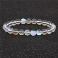 Bracelet en perles de pierre de lune aux reflets irisés et translucides sur cordon élastique - Blanc