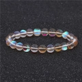 Bracelet pierre de lune aux perles de cristal rondes et reflets holographiques - Champagne