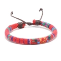 Ethnic bohemian friendship bracelet featuring red hand-woven cotton cord with rainbow stripes - Rainbow Red Base Braided Style (Style F)