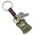 Détail du pendentif Sagittaire sur un porte-clés vintage en cuir tressé marron - Sagittaire