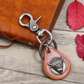 Portachiavi vintage in pelle marrone con rilievo a testa di toro argento e chiusura a scatto - Cuoio