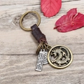 Portachiavi vintage in pelle fatto a mano con ciondolo a drago e pendente inciso su legno - Marrone