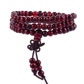 Macro shot of dark red 108 sandalwood prayer beads with classic Chinese knot and tassels - Sandalwood Lucky Knot 6mm
