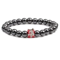 Close-up of black hematite bead bracelet with red Christmas gift box pendant detail - Gift Box