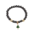 Dettaglio di perle di ematite magnetica e ciondolo natalizio ad albero smaltato - Albero di Natale Dorato