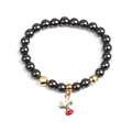 Bracciale di perline in ematite magnetica con ciondolo cervo di Natale e sfere dorate - Renna Dorata