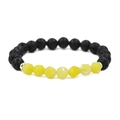 Dettaglio di perline in occhio di tigre sfaccettate e pietra lavica su bracciale elastico - Giallo