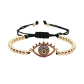 Bracelet œil porte-bonheur tressé avec perles dorées et pierres de zircon colorées - Doré