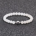 6mm witte turquoise kralenarmband met zilveren afstandhouders en de letter A - 6mm Witte Steen