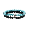 Detailed close-up of beaded bracelets with turquoise, matte black stones and Yin Yang charms - Turquoise