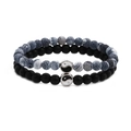 Macro detail of bead bracelets with Tai Chi yin yang charm and matte black stones - Weathered Stone