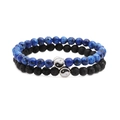 Close-up of lava stone and blue beaded bracelets with silver yin yang balance charms - Blue Flower Stone and Lava Stone