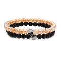 Detail of yin yang charms on lava stone and orange translucent beaded bracelets set - Faux Crystal and Lava Stone