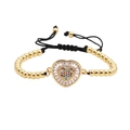 Adjustable gold beaded bracelet featuring a hollow heart charm with colorful micro-inlaid zircons - Gold