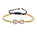 Bracciale infinito regolabile con perline dorate e pietre di zircone colorate - Oro