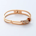 Detail view of 18K rose gold plated titanium steel bangle with five sliding crystal rings - Rose Gold (sz593)