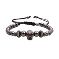 Bracciale teschio scuro con occhi di zircone rosso e perline grigie, cavo nero - Nero Teschio