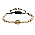 Bracciale intrecciato regolabile con perline di rame dorato e ciondolo testa di Buddha - Oro